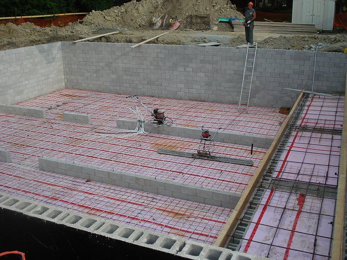 In floor radiant heating loops tied to mesh before the slab pour