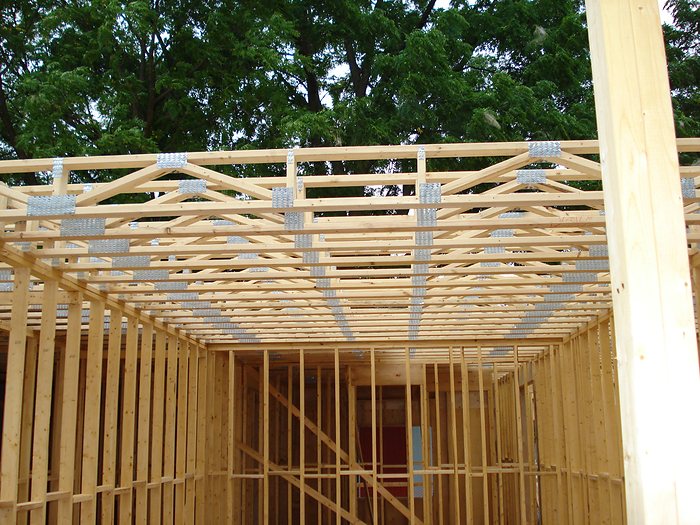 Engineered roof trusses set and braced during construction